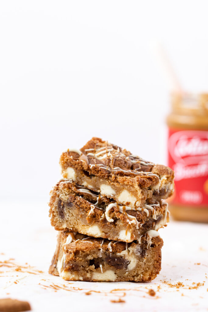 A stack of biscoff Blondies With White Chocolate Chunks
