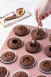 Filling galaxy cupcakes with galaxy ganache