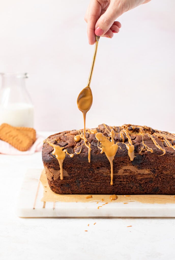 Drizzling Biscoff Spread onto banana bread