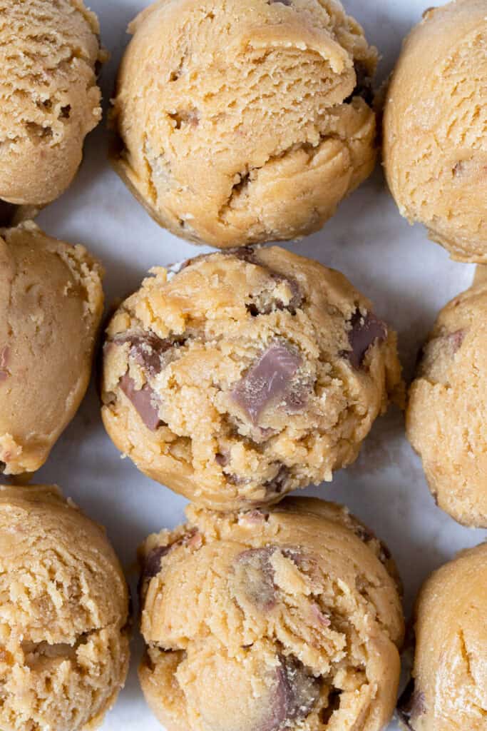 rolled balls of kinder cookie dough