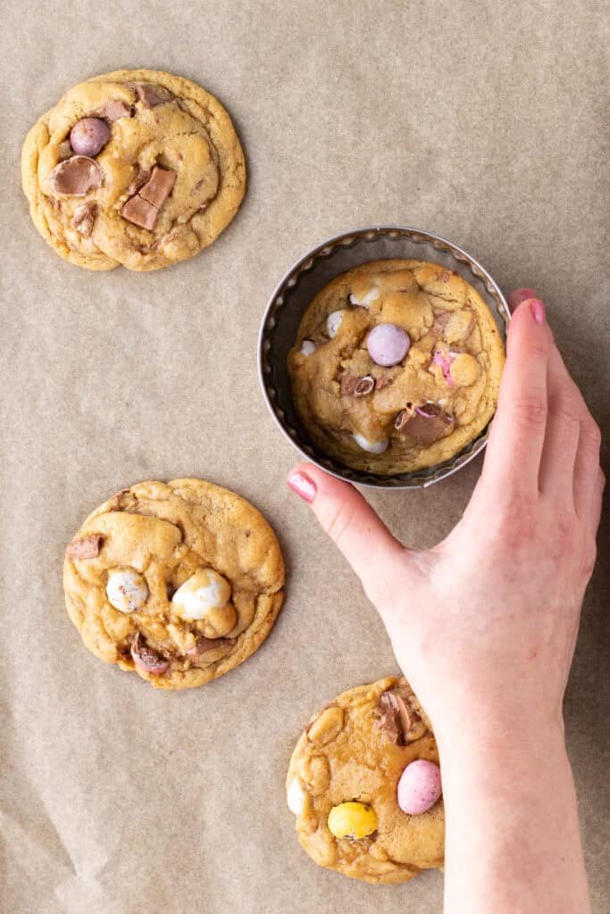 Shaping mini egg cookies with a round cookie cutter
