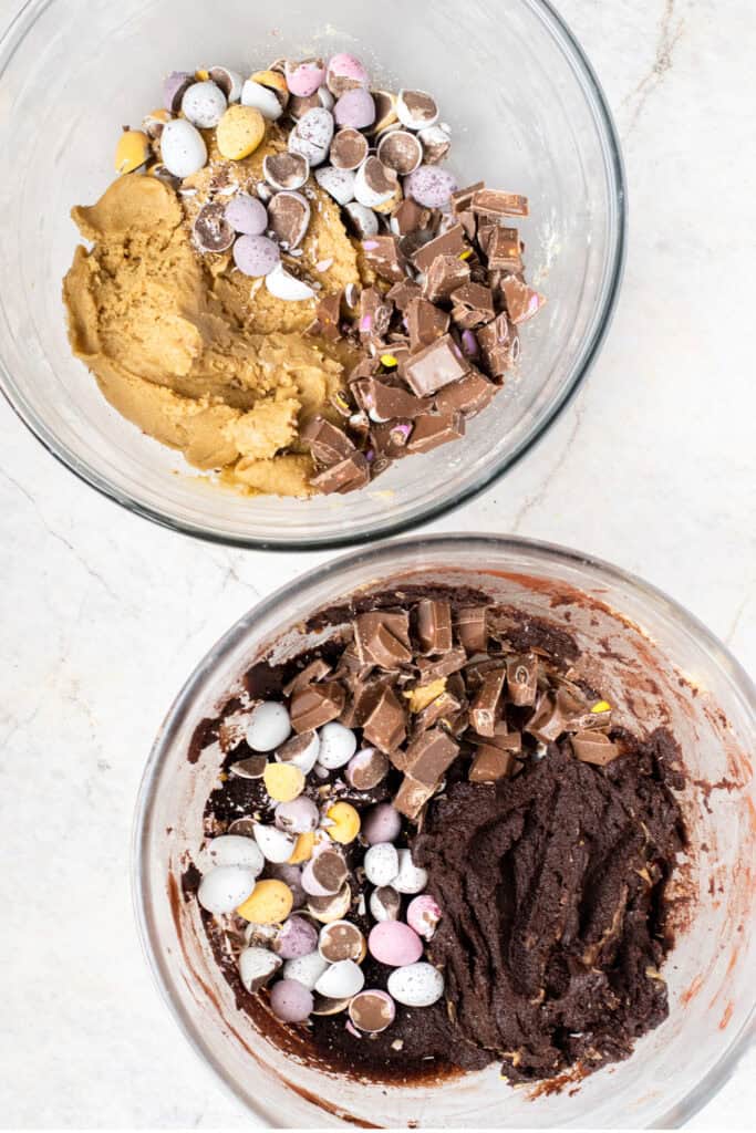 Two bowls of mini egg cookie dough - one with vanilla cookie dough and one with chocolate cookie dough