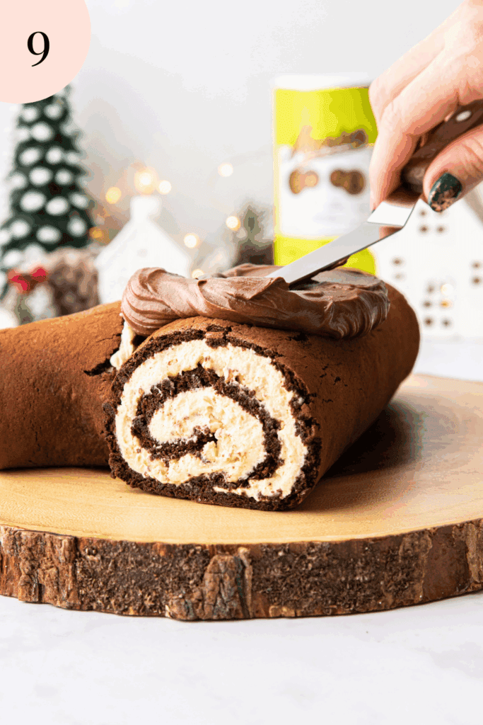 Spreading ganache on top of Chocolate yule log