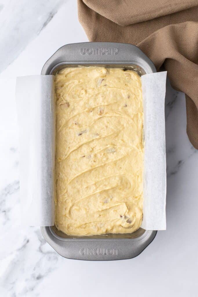 uncooked banana bread in a loaf tin