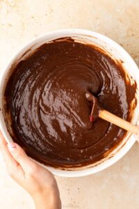 A top down view of a bowl of cake mix to make a chocolate orange reindeer cake