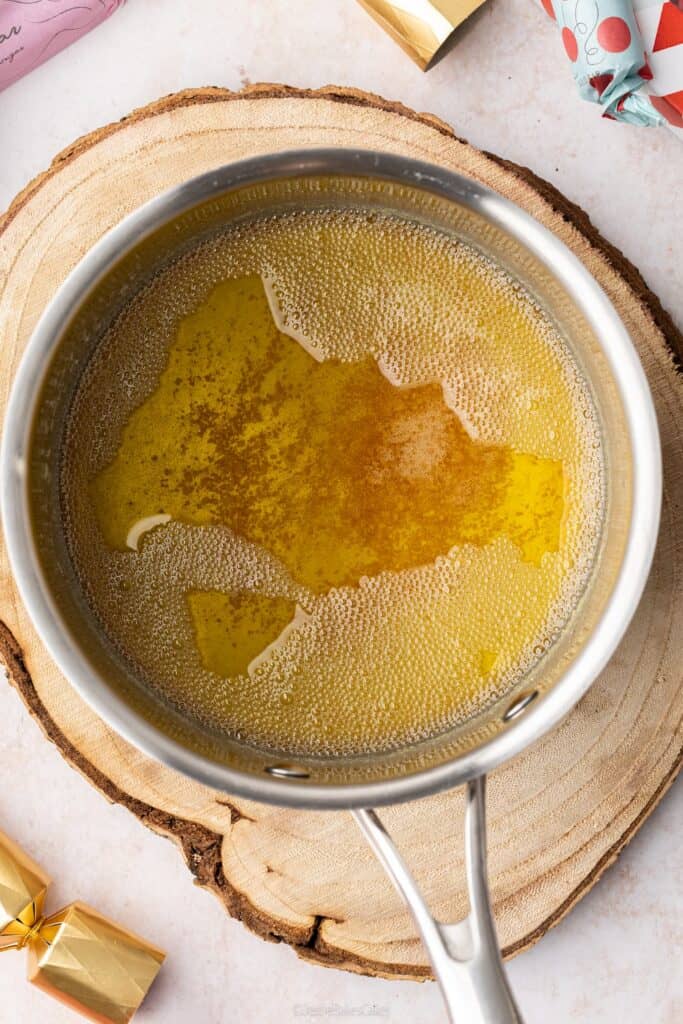 A top down view of some brown butter in a pan