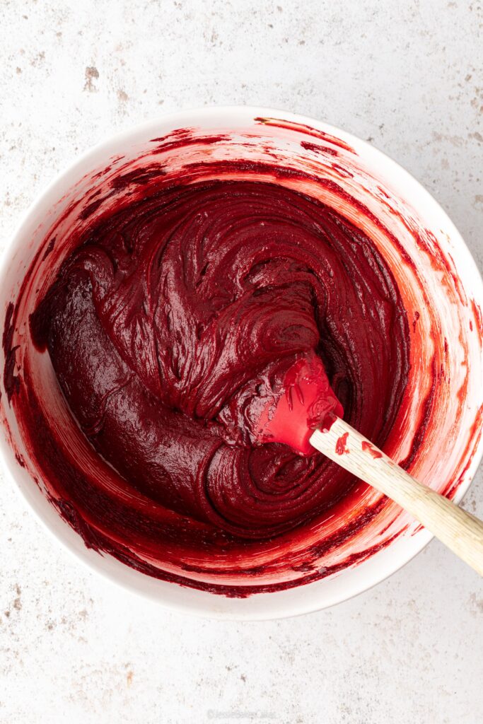 Mixing bowl of red velvet brownie mixture