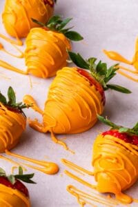 Some chocolate dipped strawberries, meant to look like carrots
