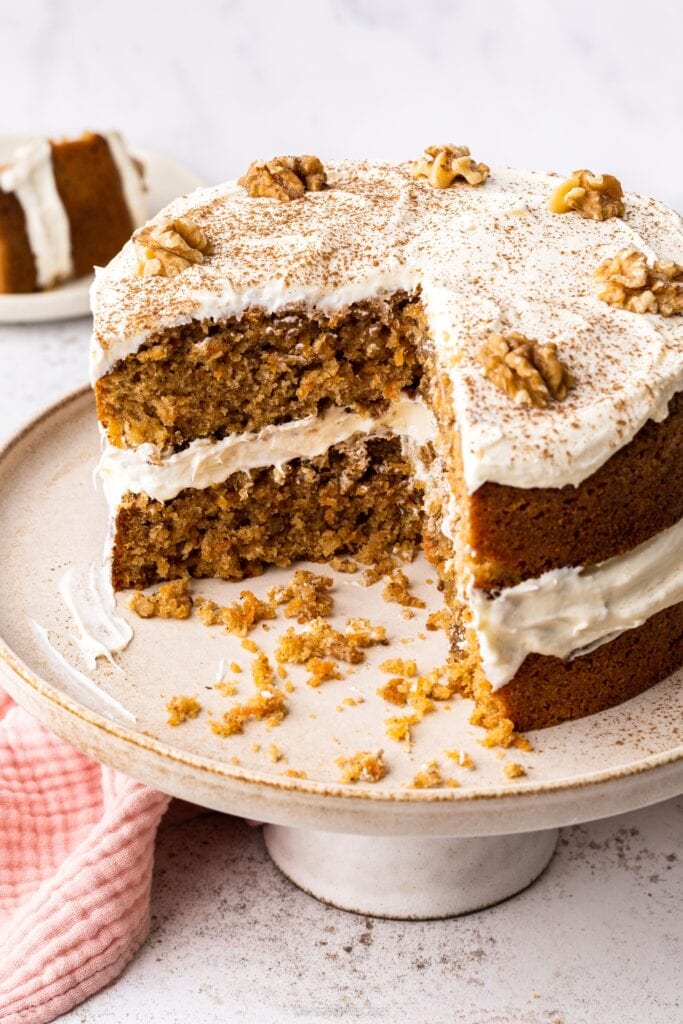 Carrot cake with slices missing to show the soft texture inside