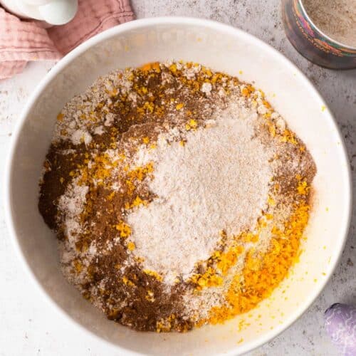 A top down view of some ingredients in a bowl, ready to make a Sticky Toffee Hot Cross Loaf Cake