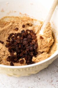 A top down view of some ingredients in a bowl, ready to make a Sticky Toffee Hot Cross Loaf Cake