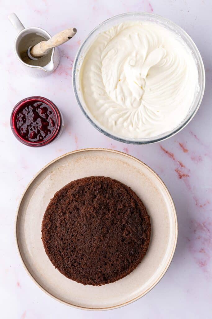 top down view of the different parts of making a black forest gateau cake recipe