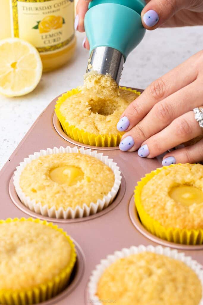 removing the middle of cupcake with a corer