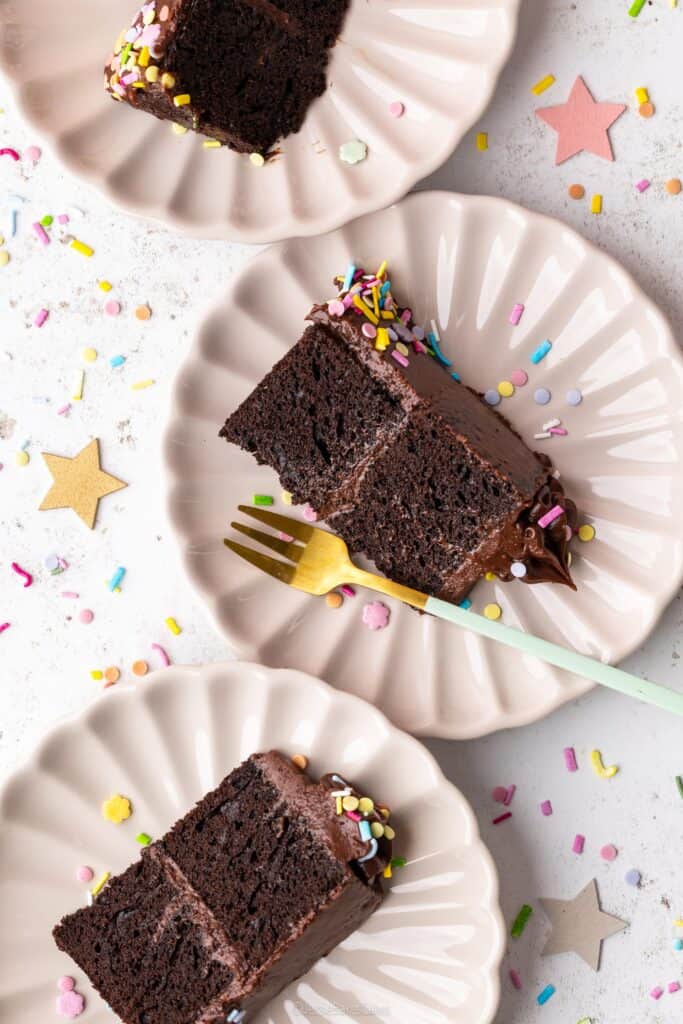 slices of mini chocolate cake on plates with a fork