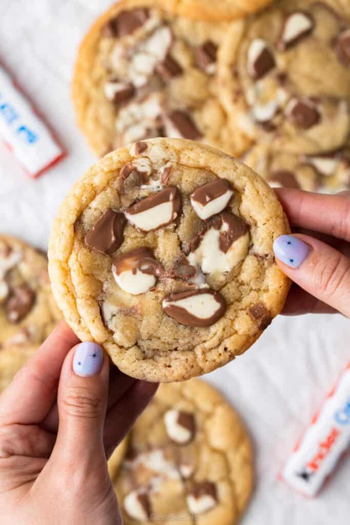 hands holding a single kinder cookie