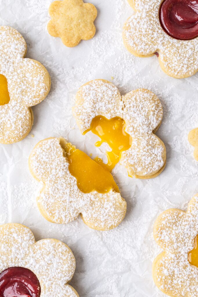 flower biscuits broken apart to show the filling oozing out 
