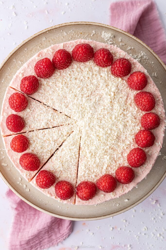 top down view of a white chocoalte raspberry mousse cake
