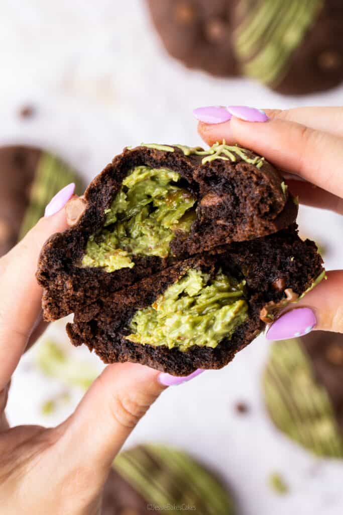 Hands holding a Dubai Chocolate Bar Cookie filled with pistachio cream Kataifi filling