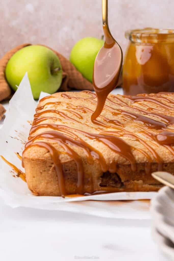 drizzling homemade Salted Caramel Sauce over apple blondies