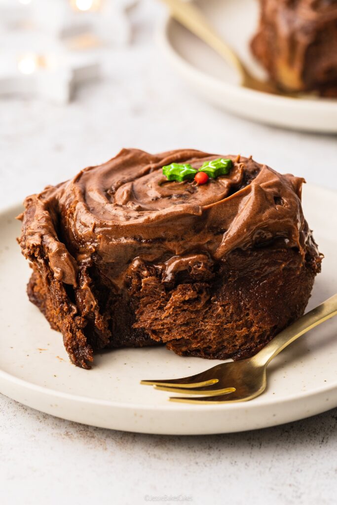 a single Christmas chocolate orange cinnamon roll on plate