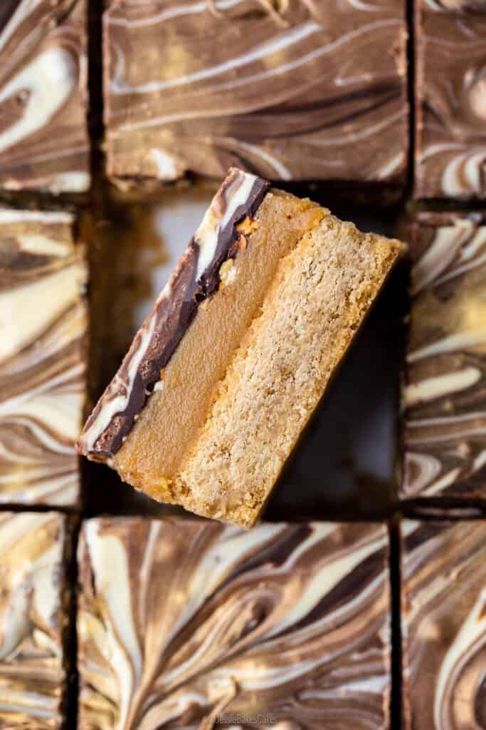 close up slice of Hazelnut Mocha Millionaires Shortbread showing the textures