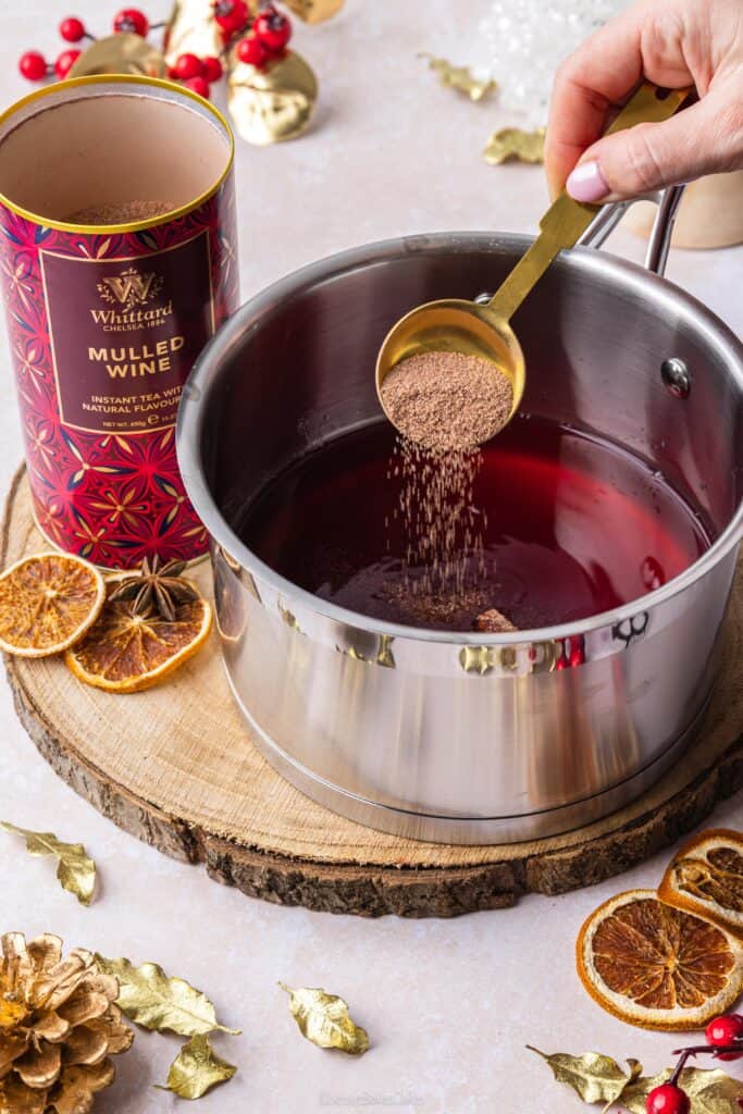 adding Whittard Mulled Wine Instant Tea to a saucepan to make mulled wine jelly