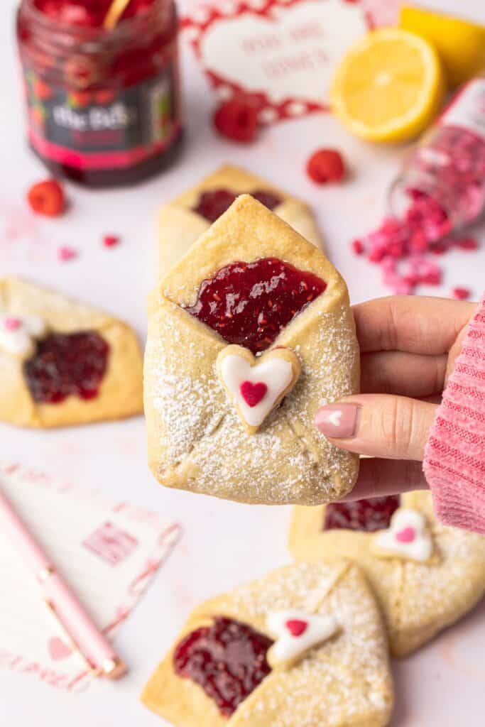 hands holding love letter shortbread biscuits