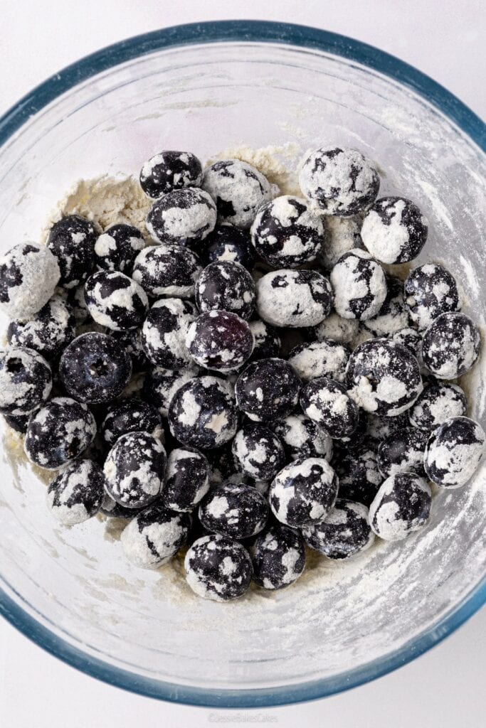 blueberries in flour to stop from sinking in the cake