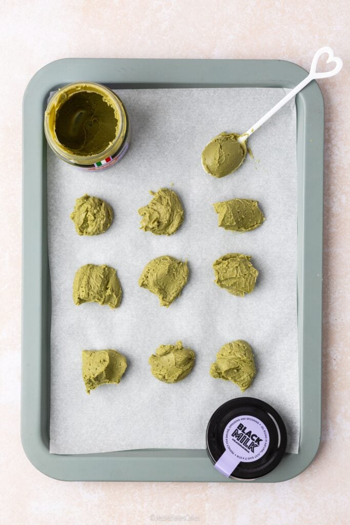 black milk pistachio cream spoonfuls on a baking tray