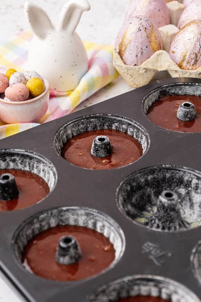 chocolate cake mixture in a mini bundt tin