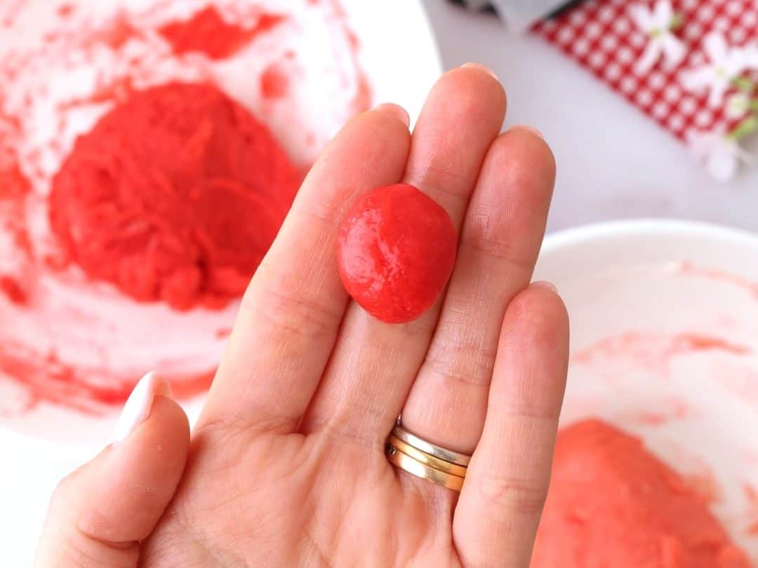 rolling the cookie dough into balls to make the flower petals
