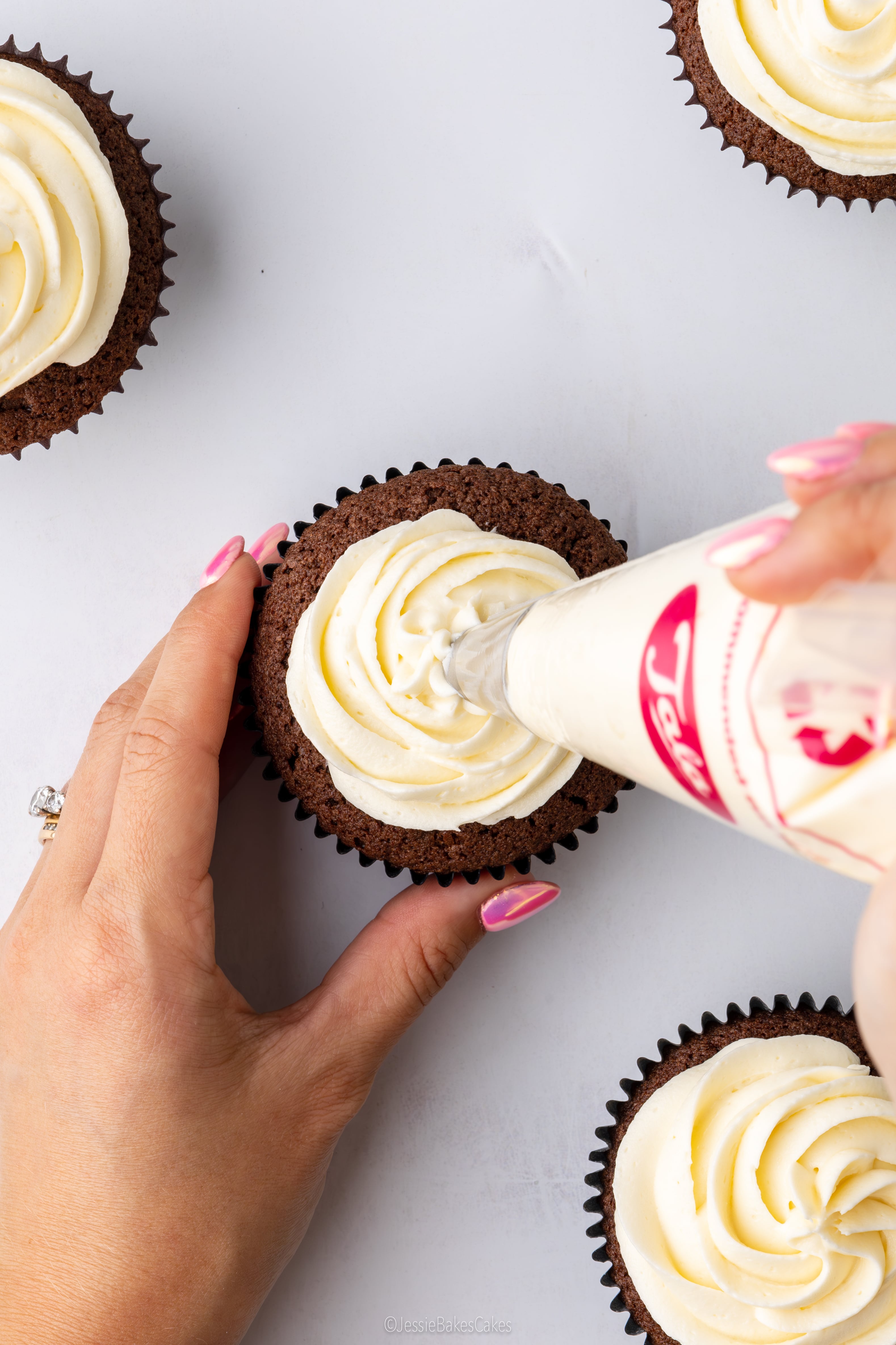 piping a cupcake