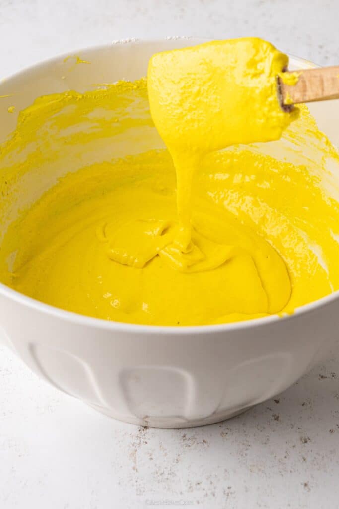 making yellow macaron shells for bee macarons