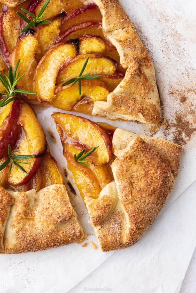 a slice of peach galette with cinnamon butter