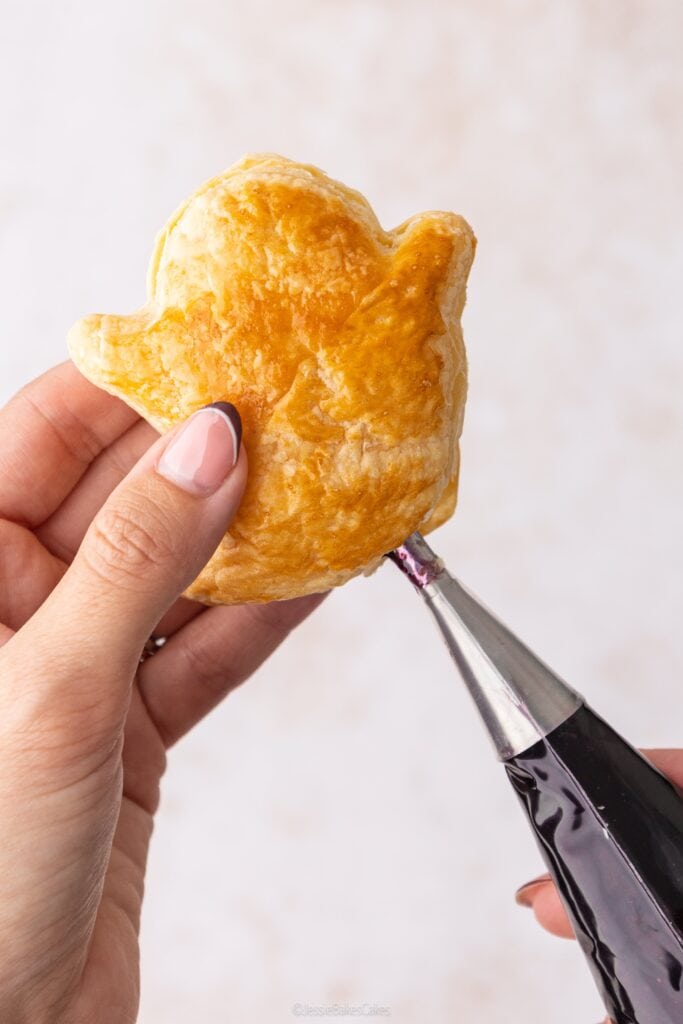 filling ghost pastries with jam