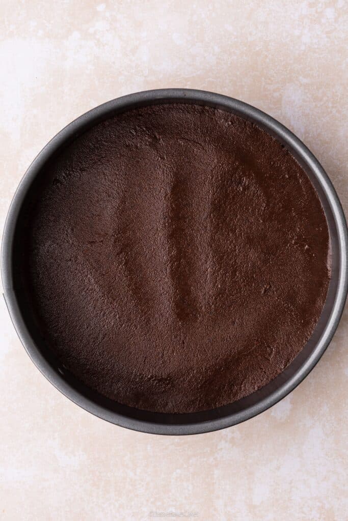 biscuit base pressed into cheesecake tin